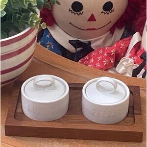 Rae Dunn white salt and pepper jars with removable lids. Wooden serving tray.